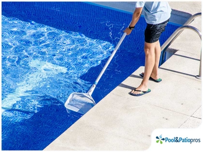 man cleaning his house pool