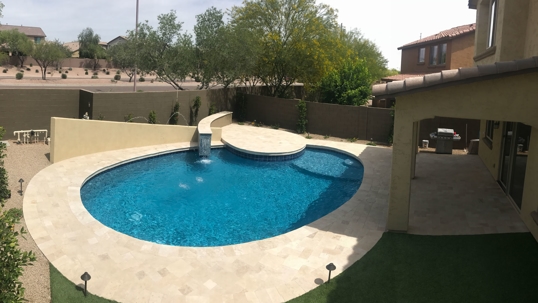 clean pool in a backyard of a house